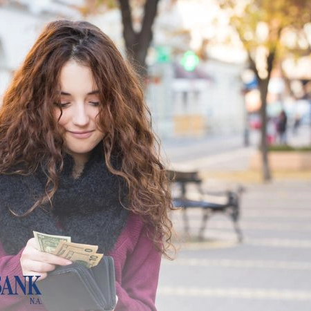 woman holding cash